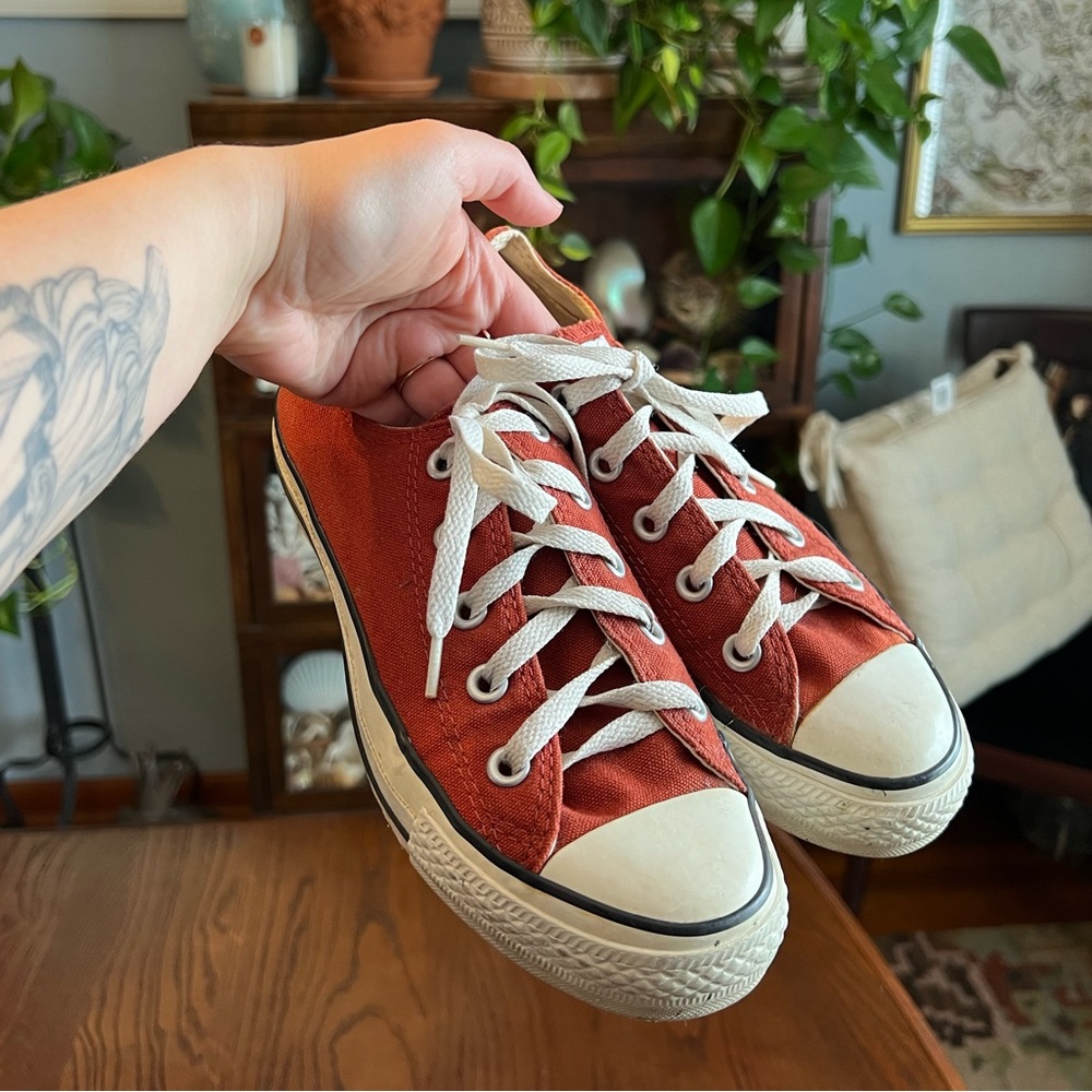 burnt orange low top converse